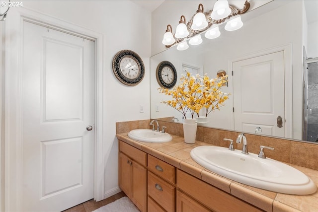 bathroom with tile patterned flooring and vanity