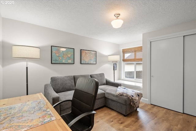 office space featuring a textured ceiling and wood finished floors