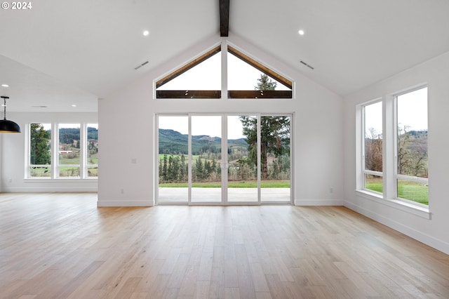 31248 Valley View Ln, Cottage Grove, OR 97424 - unfurnished living room featuring plenty of natural light, high vaulted ceiling, beam ceiling, light wood finished floors, and baseboards