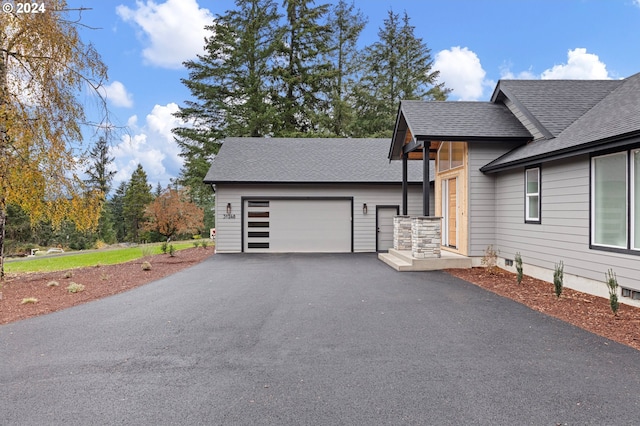 31248 Valley View Ln, Cottage Grove, OR 97424 - view of front facade featuring a garage, driveway, a shingled roof, and an outbuilding