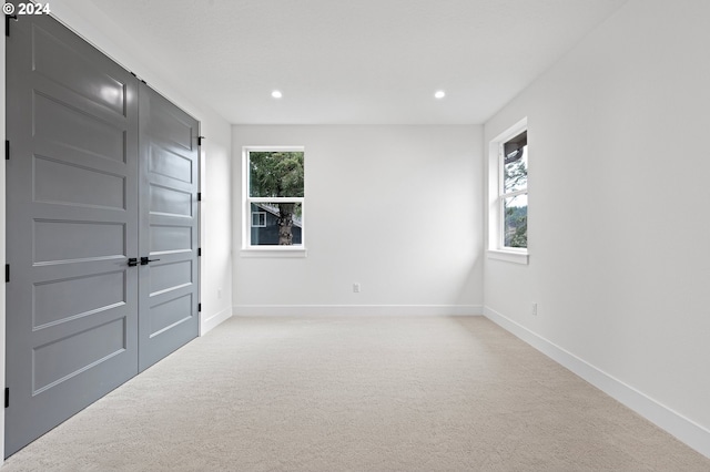 31248 Valley View Ln, Cottage Grove, OR 97424 - unfurnished bedroom with light carpet, baseboards, and recessed lighting