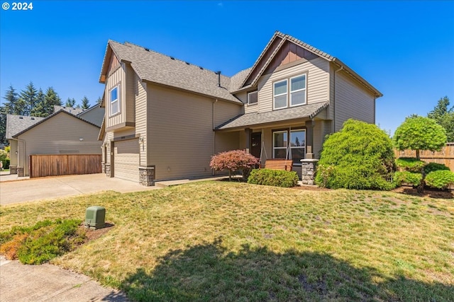 view of front of house featuring a garage and a front yard