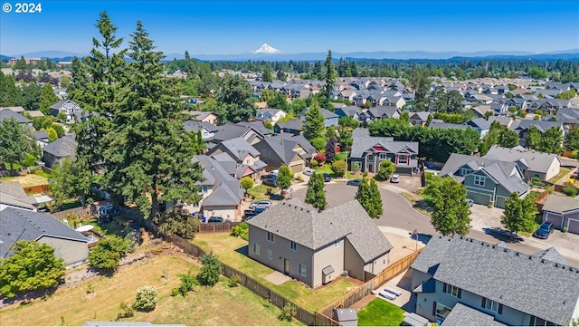 birds eye view of property with a mountain view