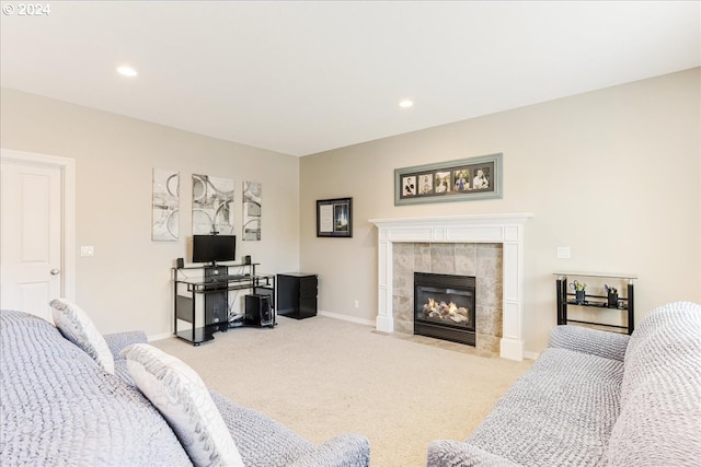 living room featuring light carpet and a tile fireplace