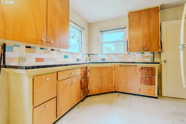 kitchen featuring backsplash and tile counters