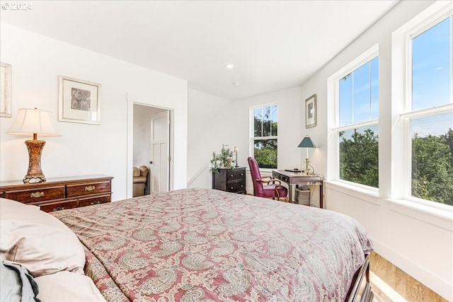 bedroom with hardwood / wood-style flooring