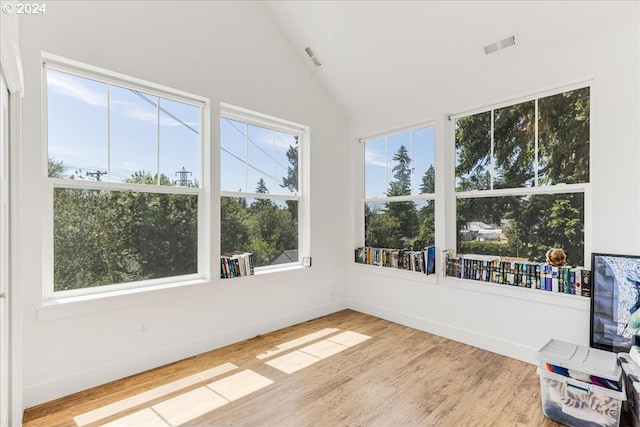 unfurnished sunroom with vaulted ceiling