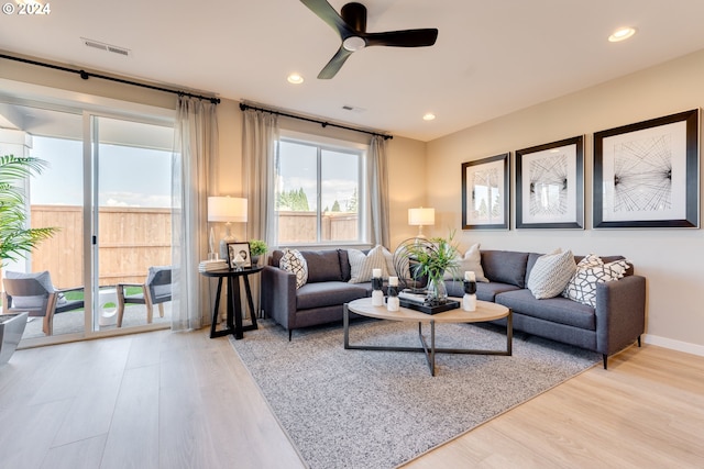 living room with visible vents, recessed lighting, ceiling fan, and wood finished floors