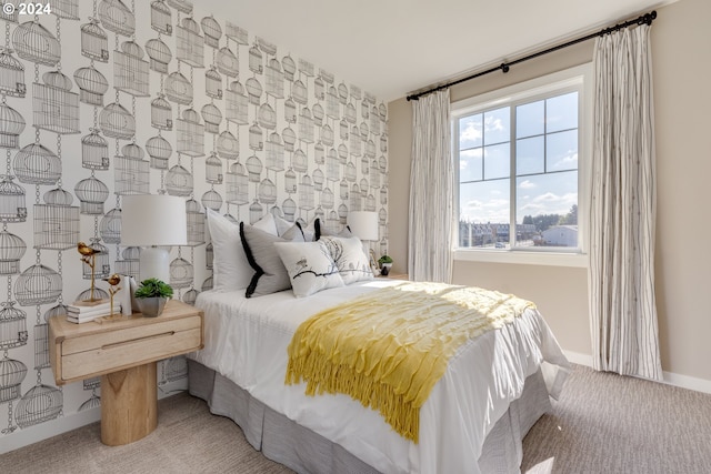 carpeted bedroom featuring baseboards