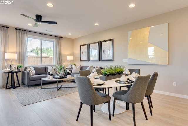 dining room featuring recessed lighting, baseboards, and light wood-style floors