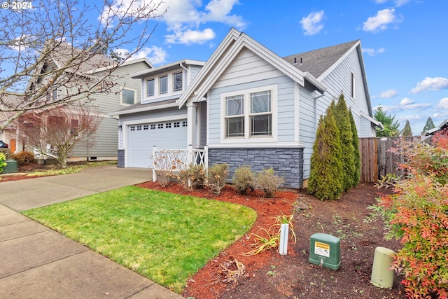 view of front of property featuring a garage and a front yard