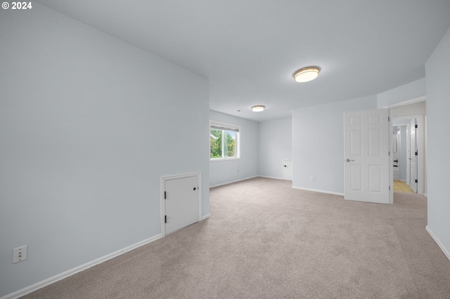 spare room with light colored carpet