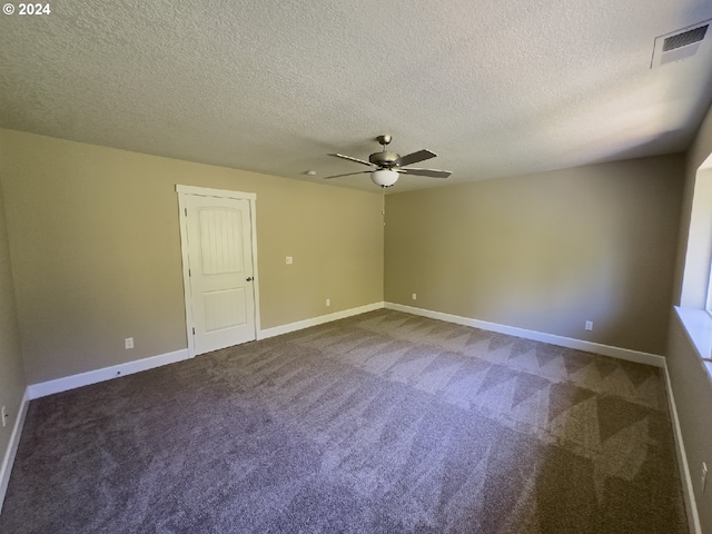 carpeted empty room with a textured ceiling and ceiling fan