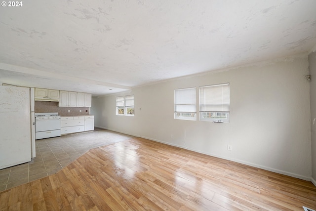 unfurnished living room with light hardwood / wood-style floors