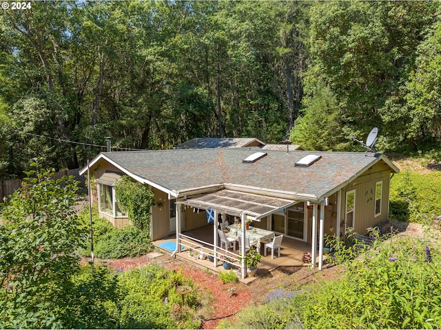 rear view of property featuring a patio