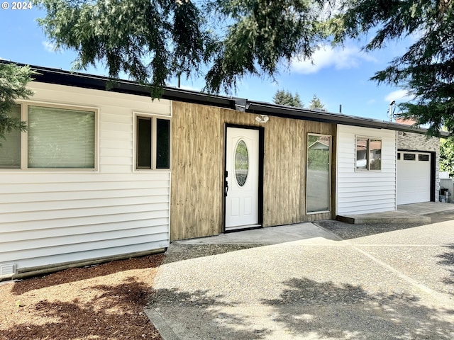 view of front of property with a garage