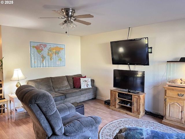 living room with ceiling fan and light wood-type flooring