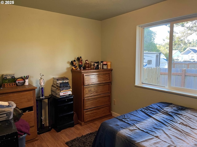 bedroom featuring hardwood / wood-style flooring