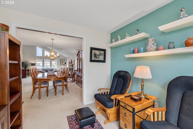 living area featuring a chandelier, light colored carpet, and vaulted ceiling