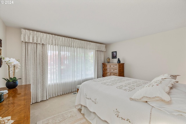 bedroom with light carpet