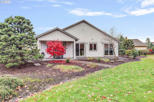 ranch-style home with a front yard