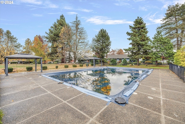 view of swimming pool featuring a gazebo and a patio