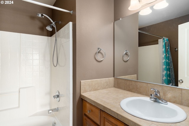 bathroom with large vanity and shower / bathtub combination with curtain