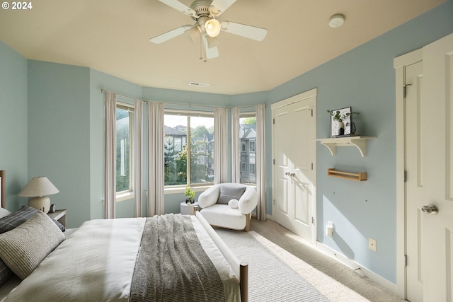 carpeted bedroom with ceiling fan