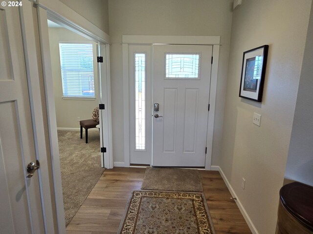 entryway with light hardwood / wood-style flooring