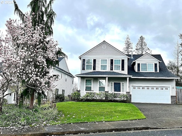 view of front facade with a front lawn and a garage