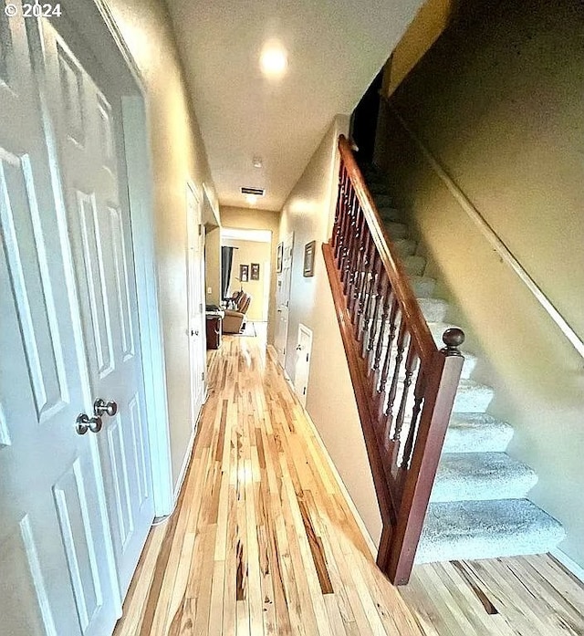 hall with light hardwood / wood-style flooring