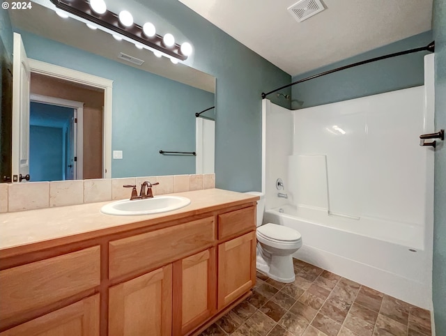 full bathroom featuring vanity, toilet, and shower / washtub combination