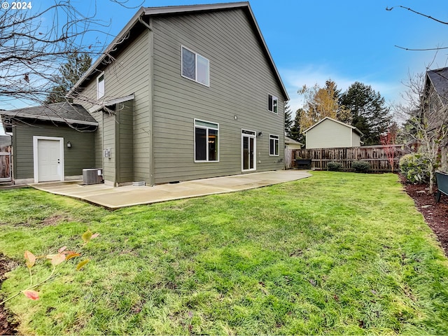 rear view of house featuring a patio area, a yard, and cooling unit