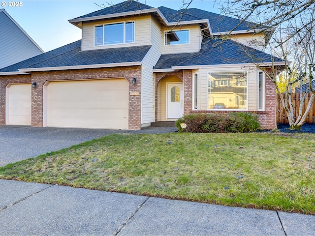 traditional-style home featuring aphalt driveway, fence, a front yard, a shingled roof, and brick siding