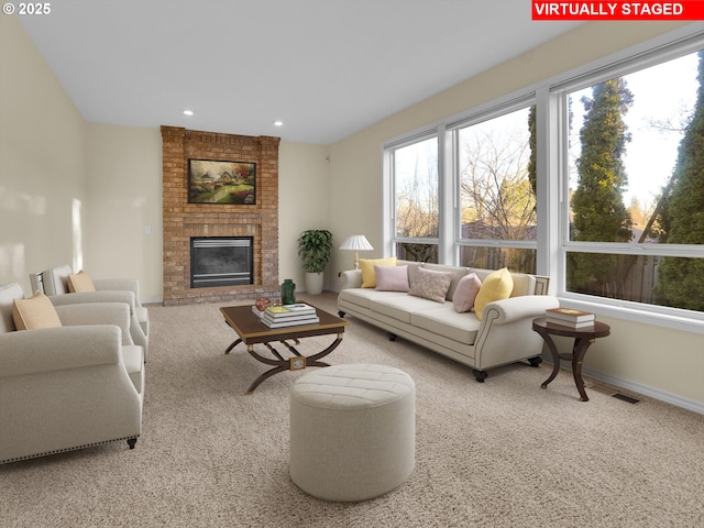 carpeted living room featuring a brick fireplace, recessed lighting, visible vents, and baseboards