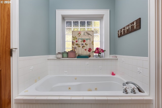 full bathroom featuring a whirlpool tub