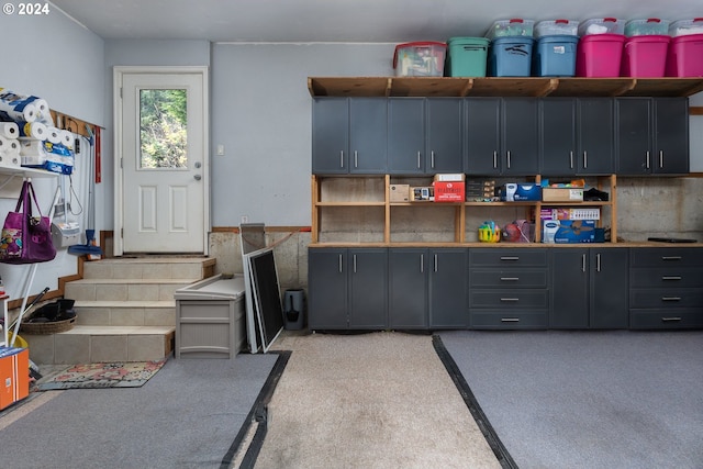 interior space featuring a wainscoted wall and open shelves