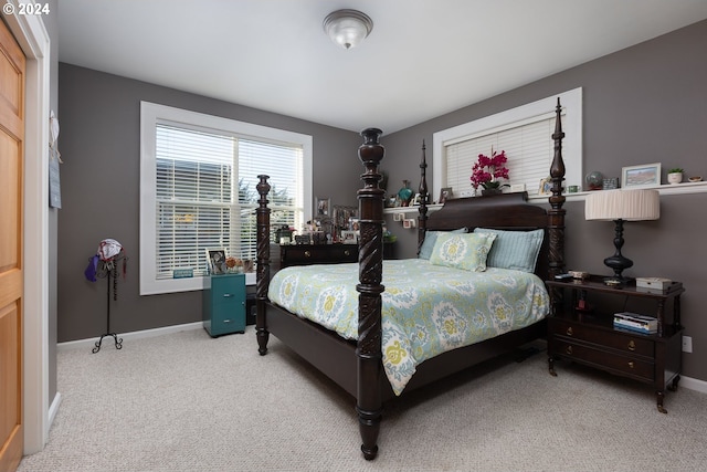 bedroom with carpet floors and baseboards