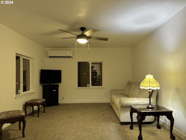 sitting room featuring light colored carpet, a wall unit AC, and ceiling fan