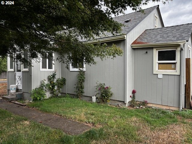 view of property exterior featuring a yard