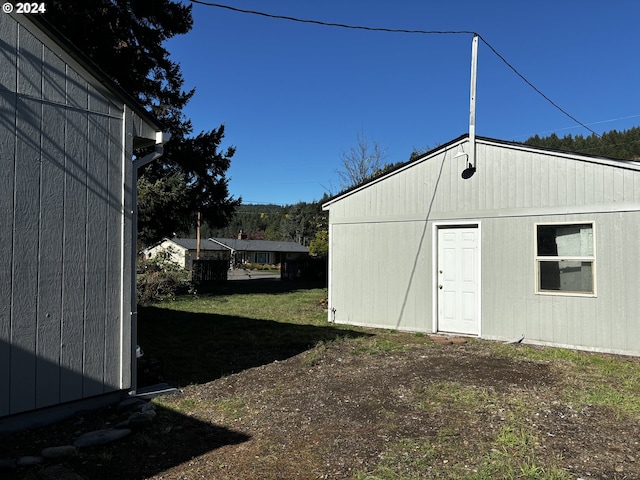 view of outdoor structure featuring a yard