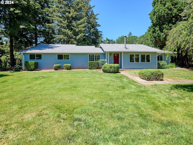 ranch-style house featuring a front yard