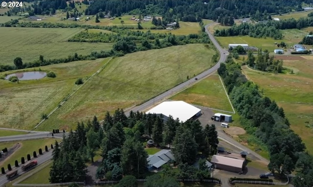 birds eye view of property featuring a rural view