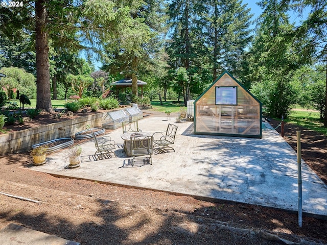 view of patio / terrace featuring an outbuilding