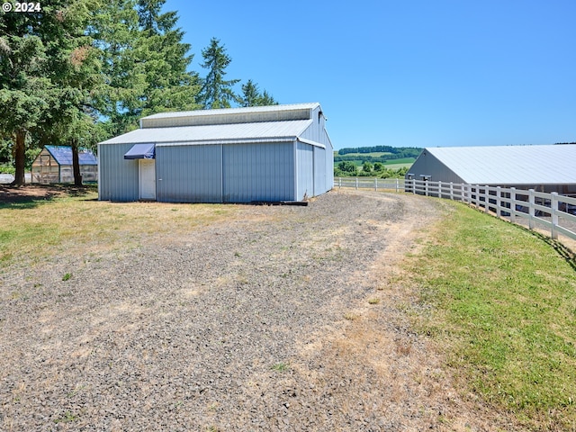 view of outbuilding featuring a rural view