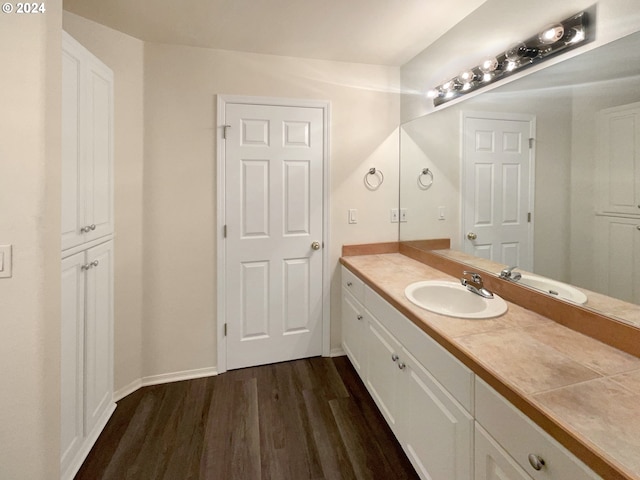 bathroom with hardwood / wood-style floors and vanity