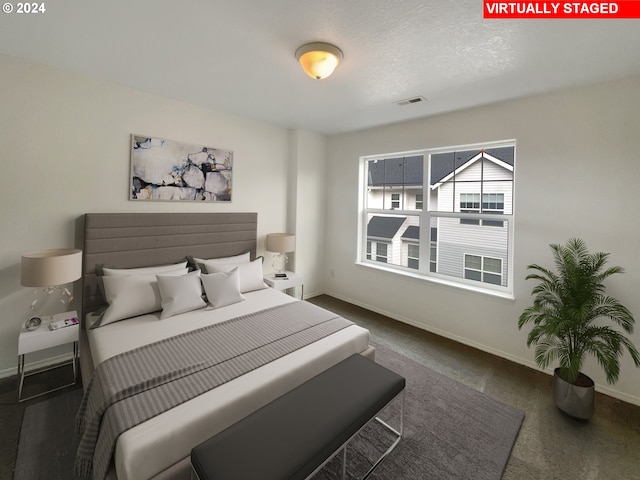 bedroom featuring a textured ceiling