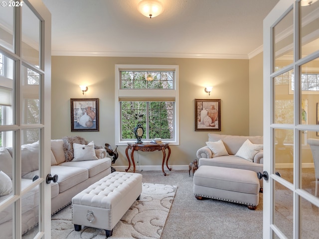 carpeted living room featuring french doors and crown molding