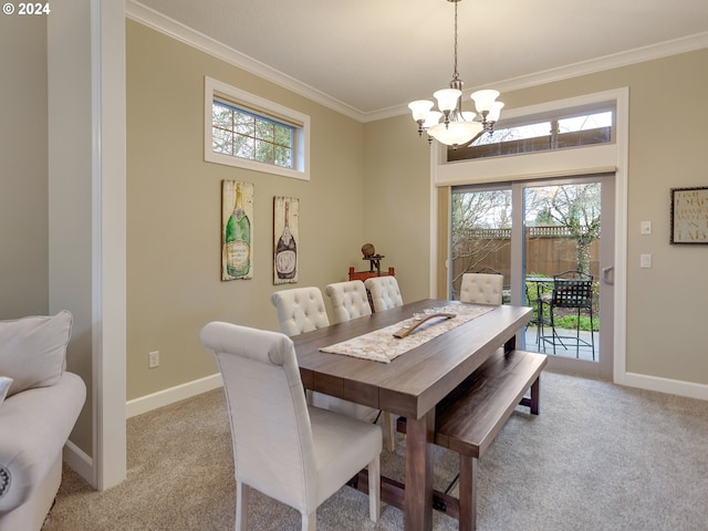 dining room featuring a wealth of natural light, light colored carpet, and an inviting chandelier