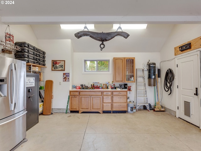 garage featuring stainless steel fridge